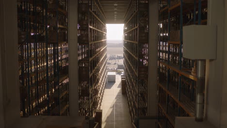 long aisle in a large warehouse with tall shelves