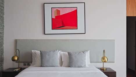 Luxury-hotel-bedroom-with-art-displayed-on-the-wall