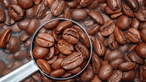 Close-up-of-seeds-of-coffee.-Fragrant-coffee-beans-are-roasted-smoke-comes-from-coffee-beans.