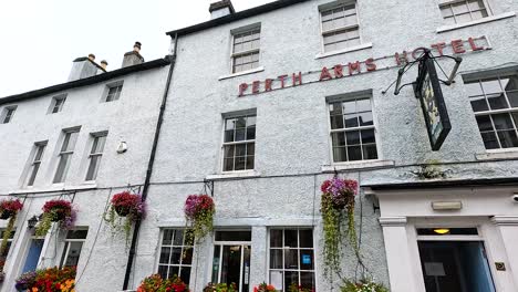 historic hotel facade with vibrant floral displays