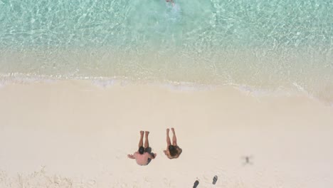 Family-having-fun-at-Bahia-de-Las-Aguilas,-turquoise-waters