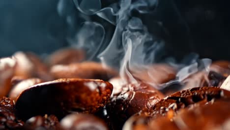 a pile of coffee beans with smoke coming out of them