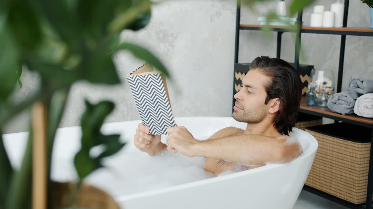 Man Reading in a Bathtub