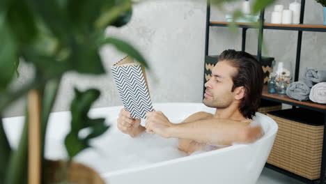 man reading in a bathtub