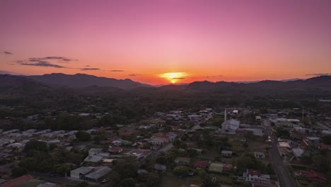 bright colorful scenic hyperlapse sunset over costa rica urban community, 4k drone