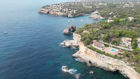 coastal cliffs and sea views on the east of mallorca during the summer, aerial