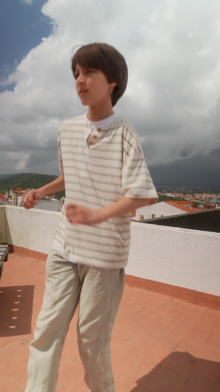 Boy Walking on a Rooftop