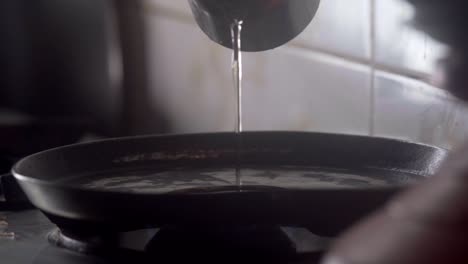 pouring oil on hot pan