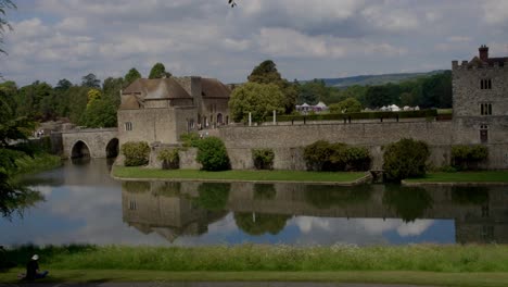 4k peaceful wide shot of leeds castle on a sunny day, kent england - the loveliest castle in the world