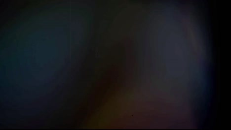 realistic colorful light leak on black background.