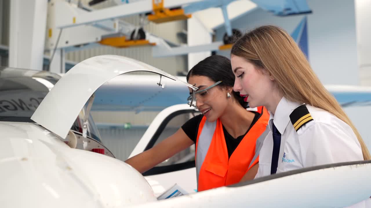 Aircraft Mechanics and Pilots Inspecting an Airplane