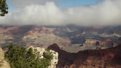 a zoom out from the grand canyon showing cloud cover