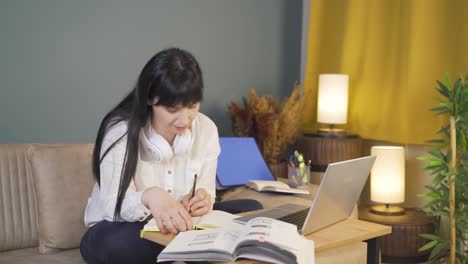 a student studying with a friend over video call.