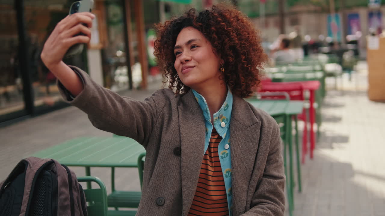 Young Woman Taking a Selfie in the City