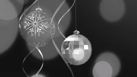 Animation-of-christmas-baubles-over-black-background