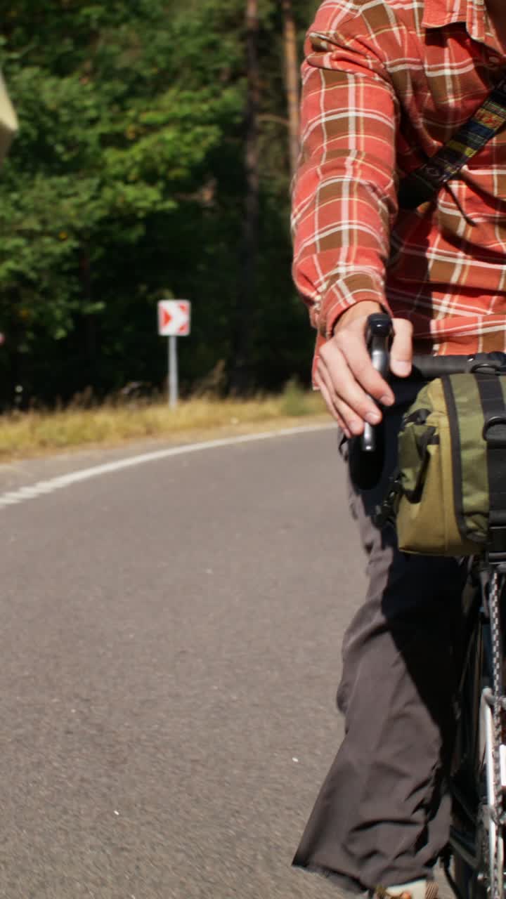 People cycling on a road with bike bag