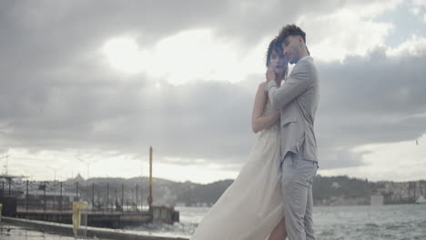 romantic wedding couple by the water