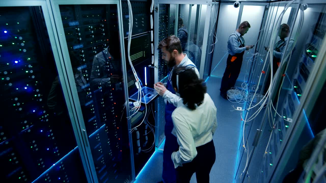 Top view, people work in the data center in the server room