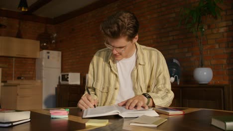 young man studying at home