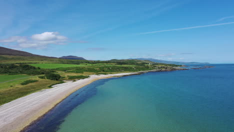 aerial landscape of an empty beach and turquoise sea on a scottish island, and a summers day