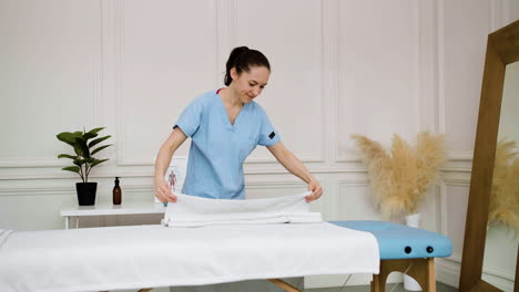 physiotherapist preparing the massage room