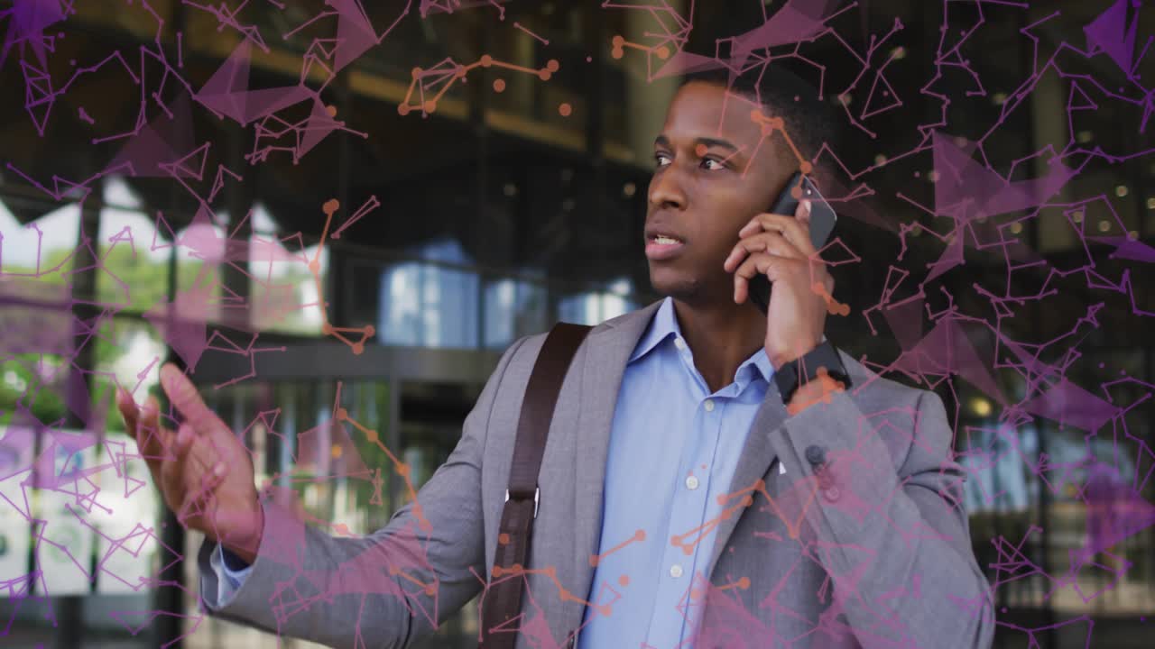 Businessman exiting lobby and answering smartphone call for data briefing, with network overlay