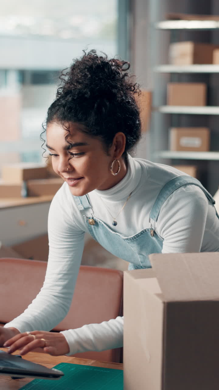 Young Woman Working on Laptop in Her E-commerce Business Office