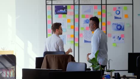 Side-view-of-young-cool-mixed-race-business-team-planning-and-working-in-a-modern-office-4k