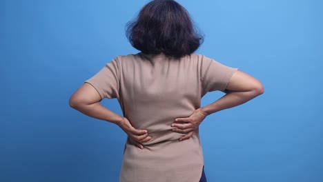 woman suffering from severe back pain