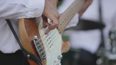 Man-playing-classic-guitar-in-a-party