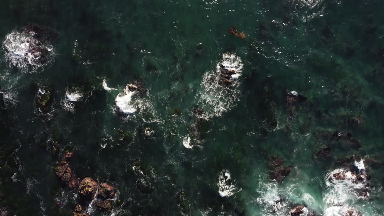 Slow Motion Bird's Eye View of the ocean waves at Asilomar Beach in Monterey