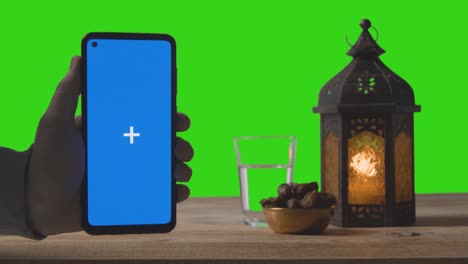 Wide-Shot-of-Lantern-Dates-and-Water-with-Green-Screen-and-Blue-Screen-Phone