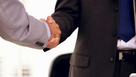 close up of businessmen shaking hands