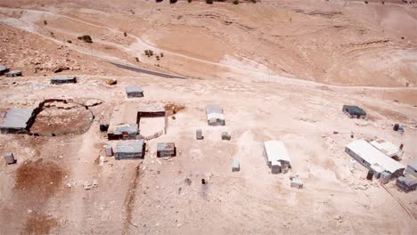 aerial views of desert settlements and arid landscapes