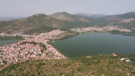 Aerial-clip-over-a-mouintain-revealing-the-city-and-lake-of-Kastoria,-in-northern-Greece