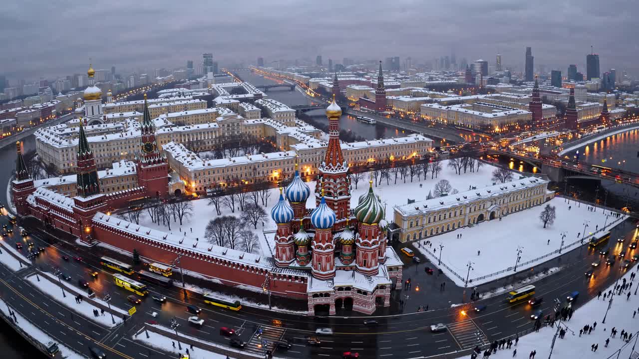 Aerial view of a snow-covered cityscape with vibrant architecture, capturing the bustling streets