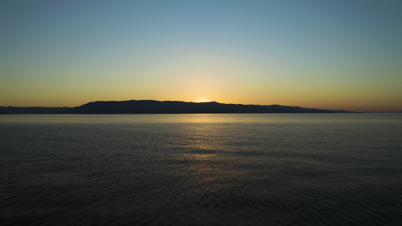 Flyiing Above Flathead Lake At Sunset In Summer In Montana, USA