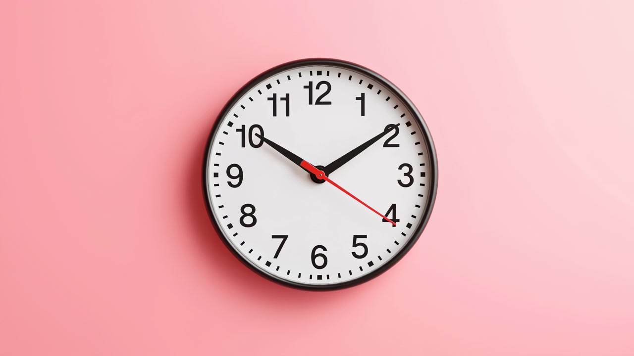 Analog Wall Clock On Pink Background Displaying Time With Red Second Hand, Clean Minimalist Design, Soft