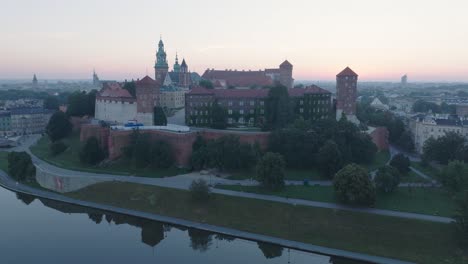 aerial drone shot of krakow poland wawel castle old town with the river vistula at sunrise