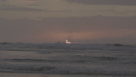 sunset over the waves