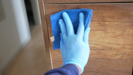 cleaning a wooden cabinet