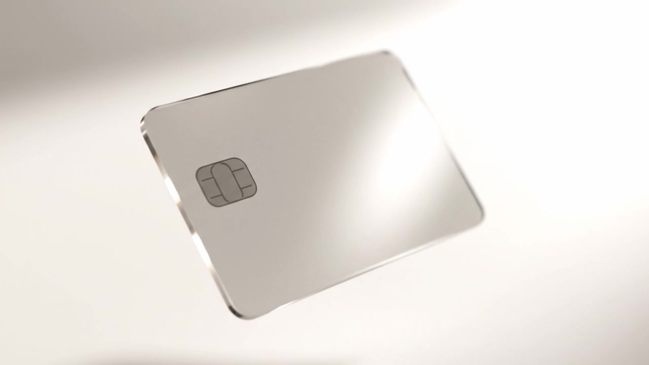 Una carta di credito elegante e moderna che fluttua con grazia su uno sfondo minimalista, mettendo in risalto il suo design raffinato e le sue caratteristiche innovative.