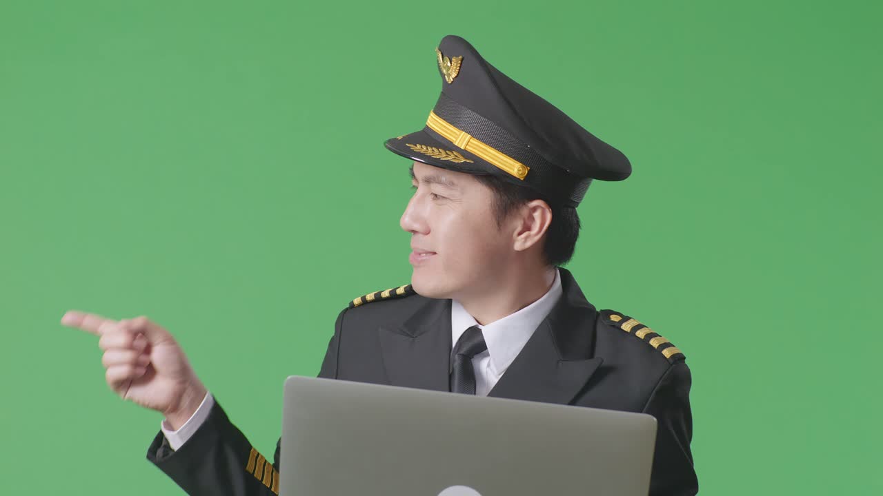 Pilot with Laptop on Green Screen
