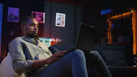 vertical video black male freelancer taking online course to learn new skills from home