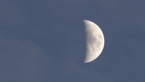 half moon and moving clouds, cloud and moon in the blue sky,