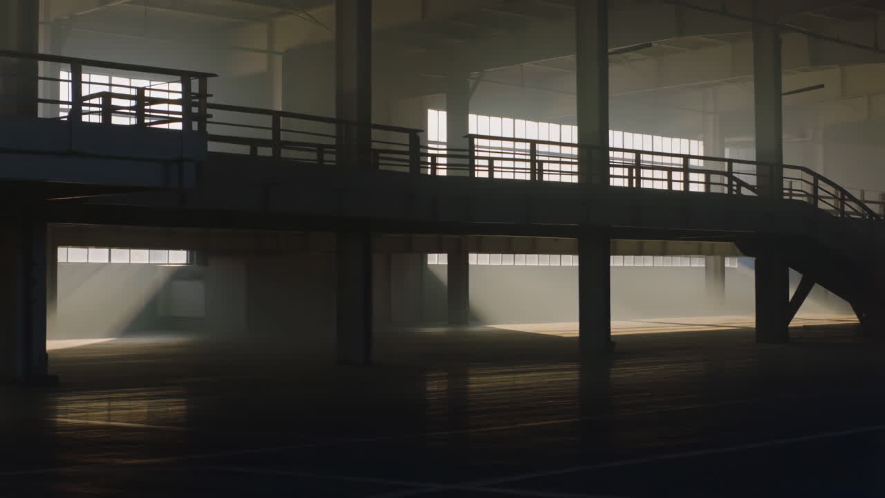 Empty Industrial Space with Sunlight and Dust Rays