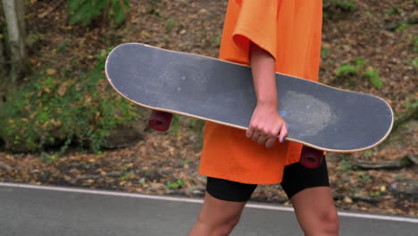 woman skateboarding outdoors