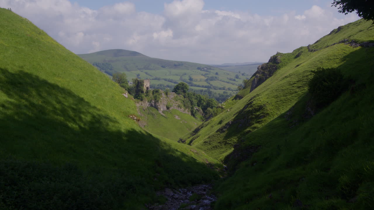 Dramatic Green Valley with Ancient Castle Ruins