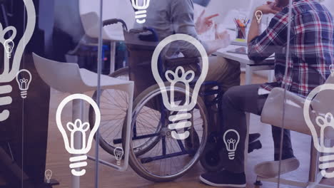 animation of lightbulbs over disabled man in wheelchair discussing with his business colleague