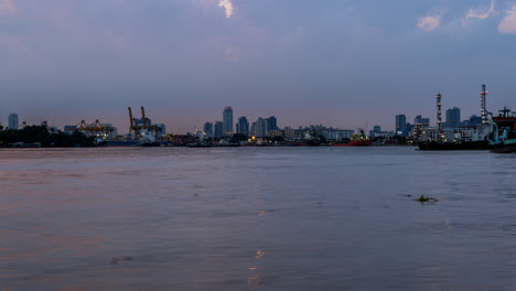 Boats,-large-and-small,-ply-up-the-busy-river-as-dusk-falls